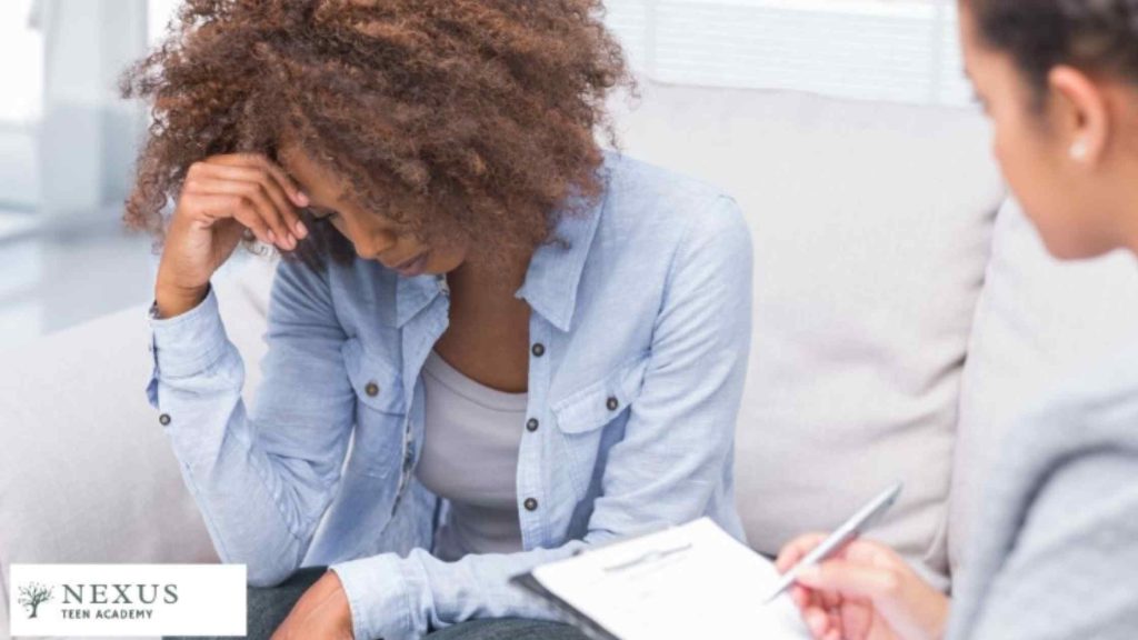 Concerned mother talking with a therapist about how to help her Teenager with Depression at Nexus Teen Academy.