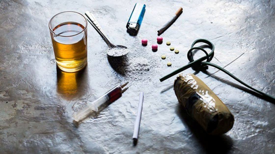 Alcohol, drugs, and paraphernalia representing Alcohol + THC in Teen Boys and the serious risks of mixing substances.