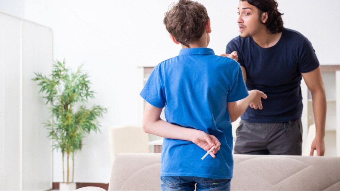 Father confronting his son hiding marijuana, reflecting a moment when parents must choose punishment or therapeutic support.