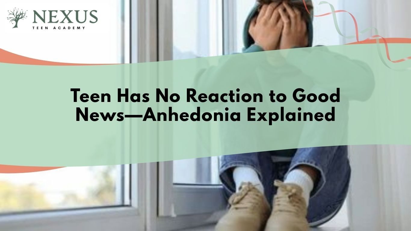 Teen sitting alone by window with head in hands showing emotional numbness, representing anhedonia and lack of reaction to good news in teens