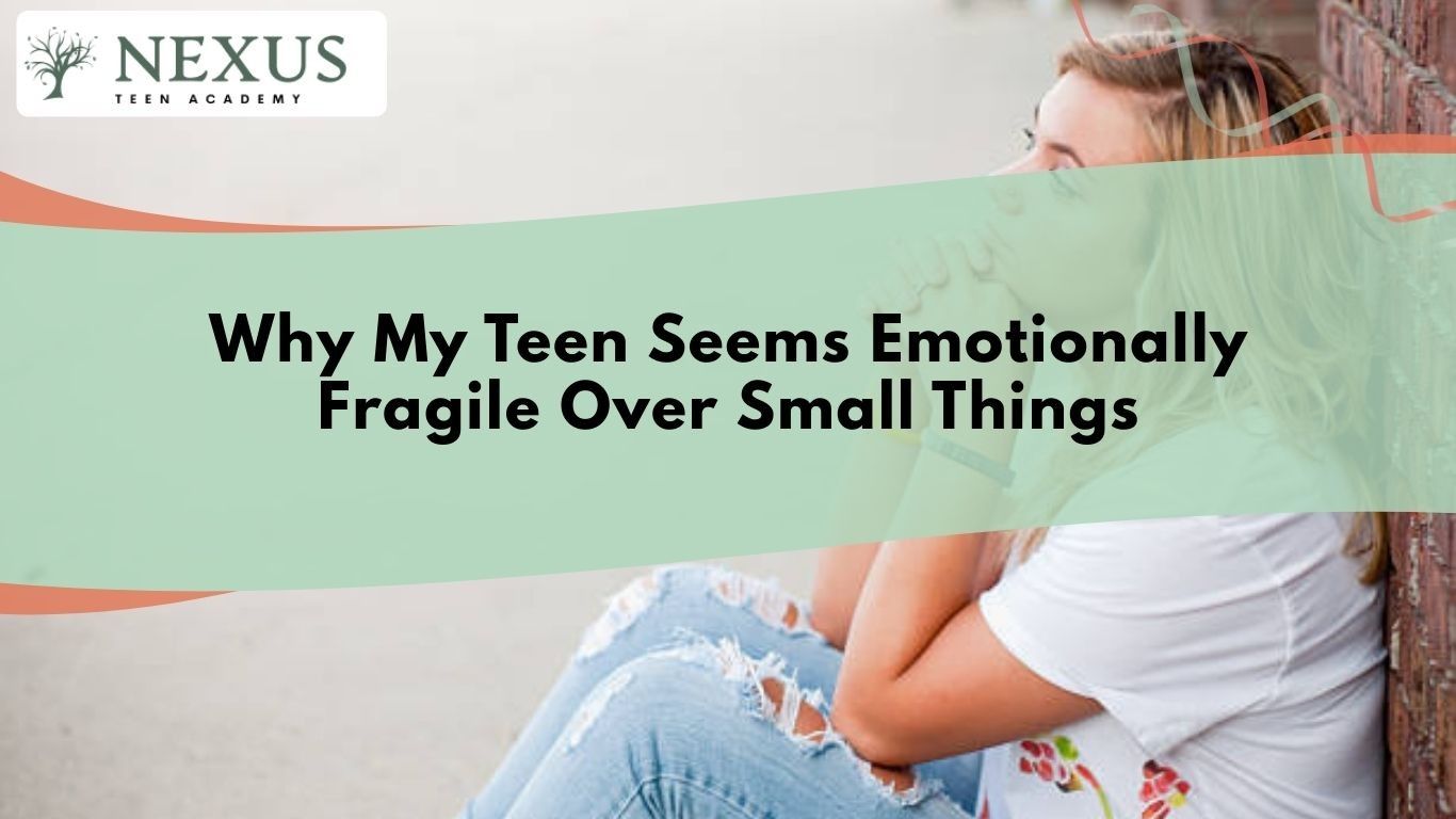 Teen girl sitting alone against a wall looking upset and overwhelmed, illustrating emotional fragility and heightened sensitivity in teens
