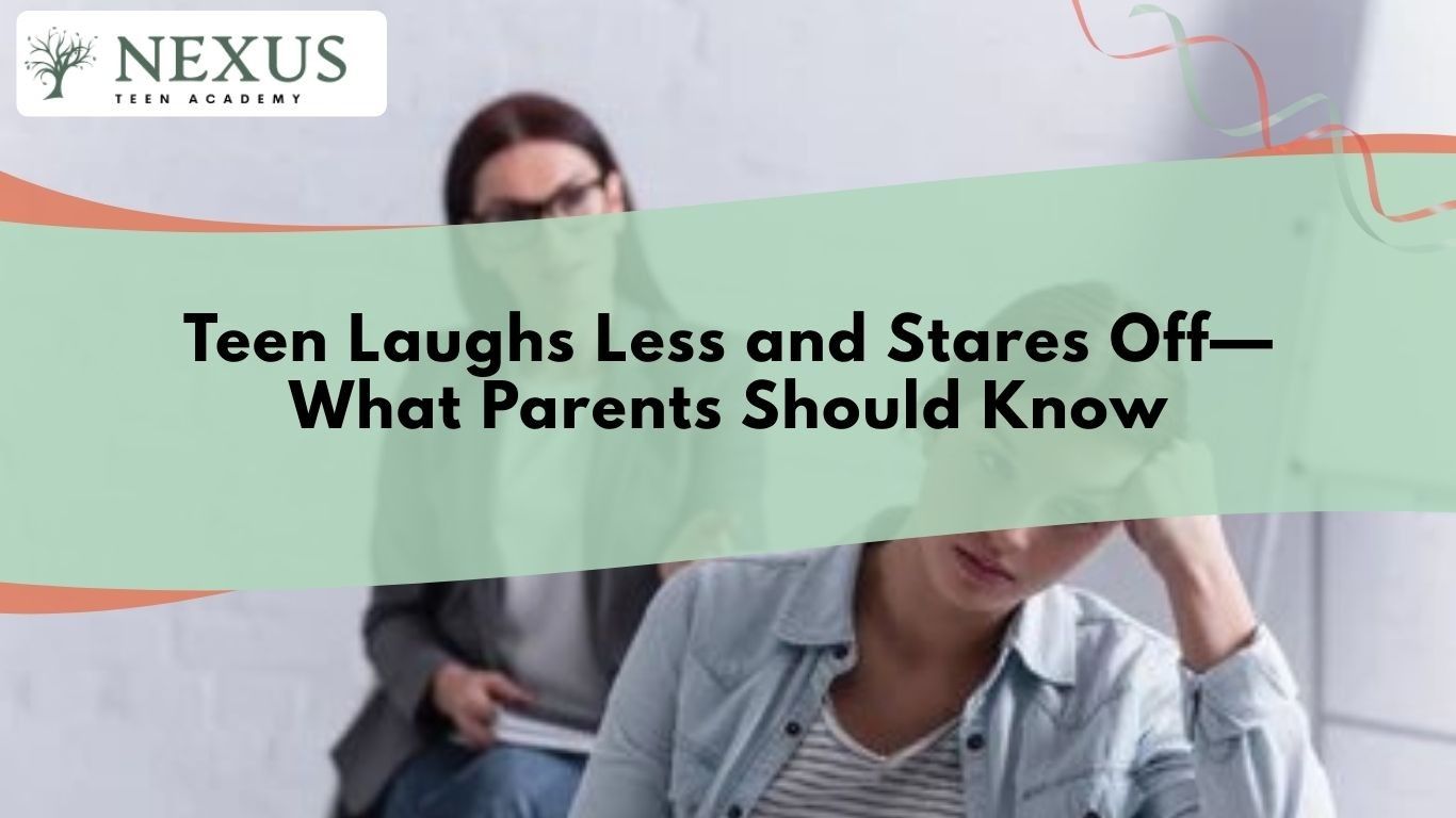 Teen in counseling session looking withdrawn as therapist observes, reflecting signs when a teen laughs less and stares off.