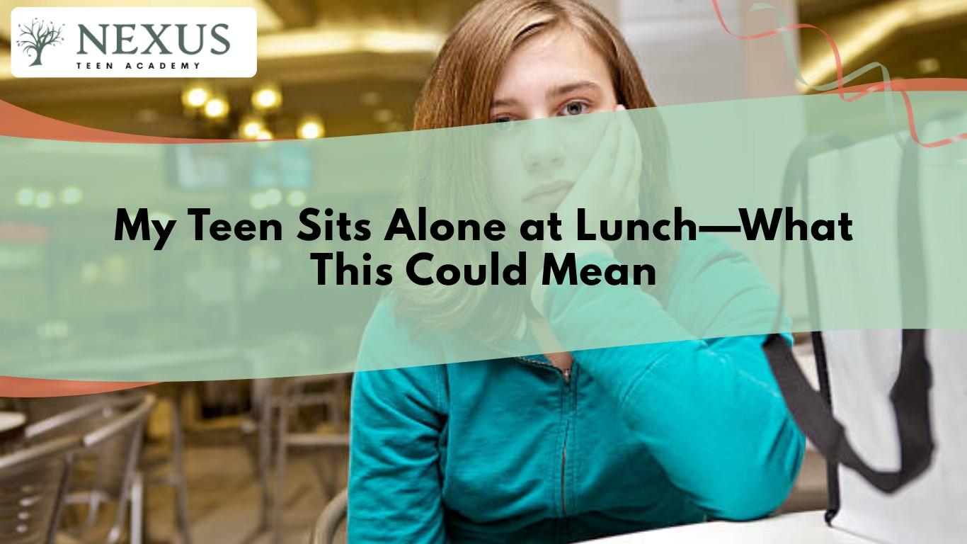 Teen girl sitting alone at cafeteria lunch table showing isolation, social anxiety, and teen mental health concerns in public.