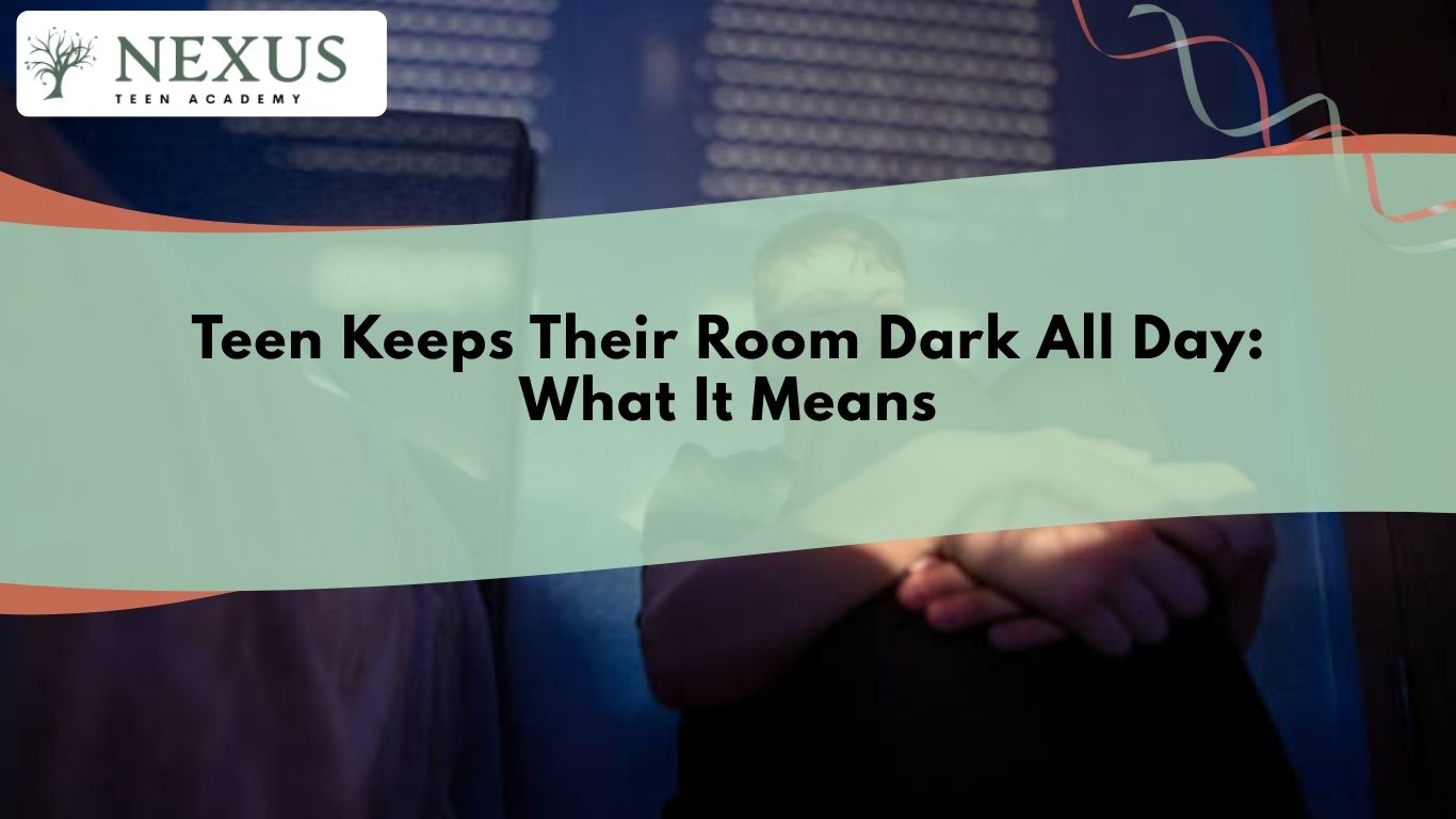 Teen sitting in a dimly lit room with curtains closed, illustrating emotional withdrawal and isolation concerns in teens.