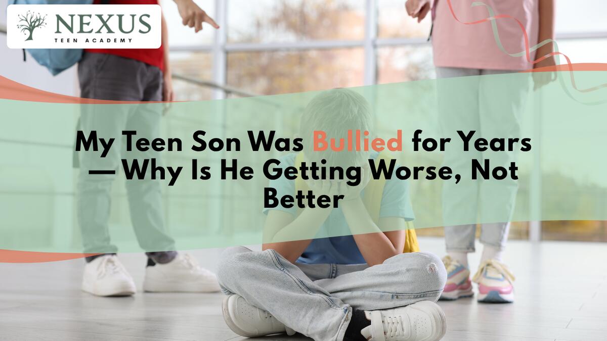 Teenage boy sitting alone, withdrawn after years of bullying